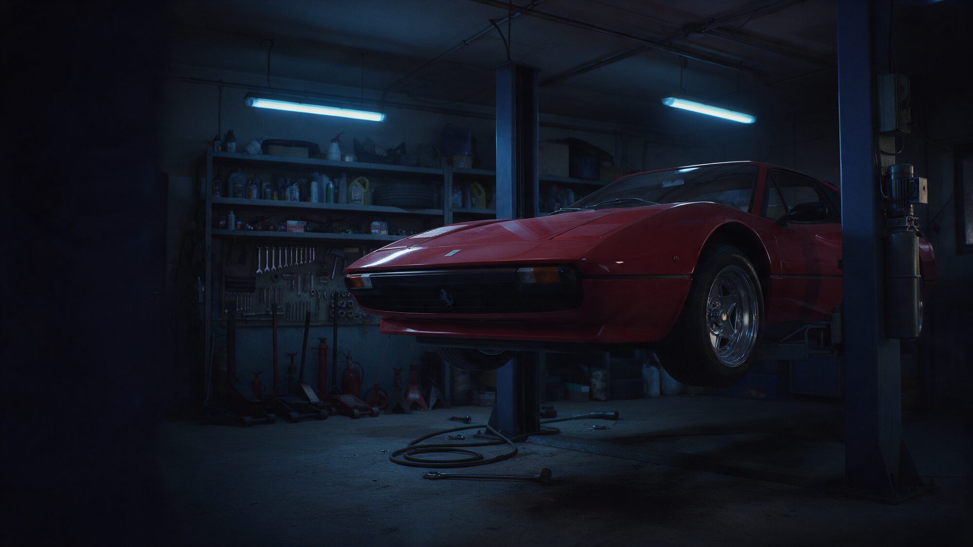 Classic red sports car raised on a lift in a dark workshop