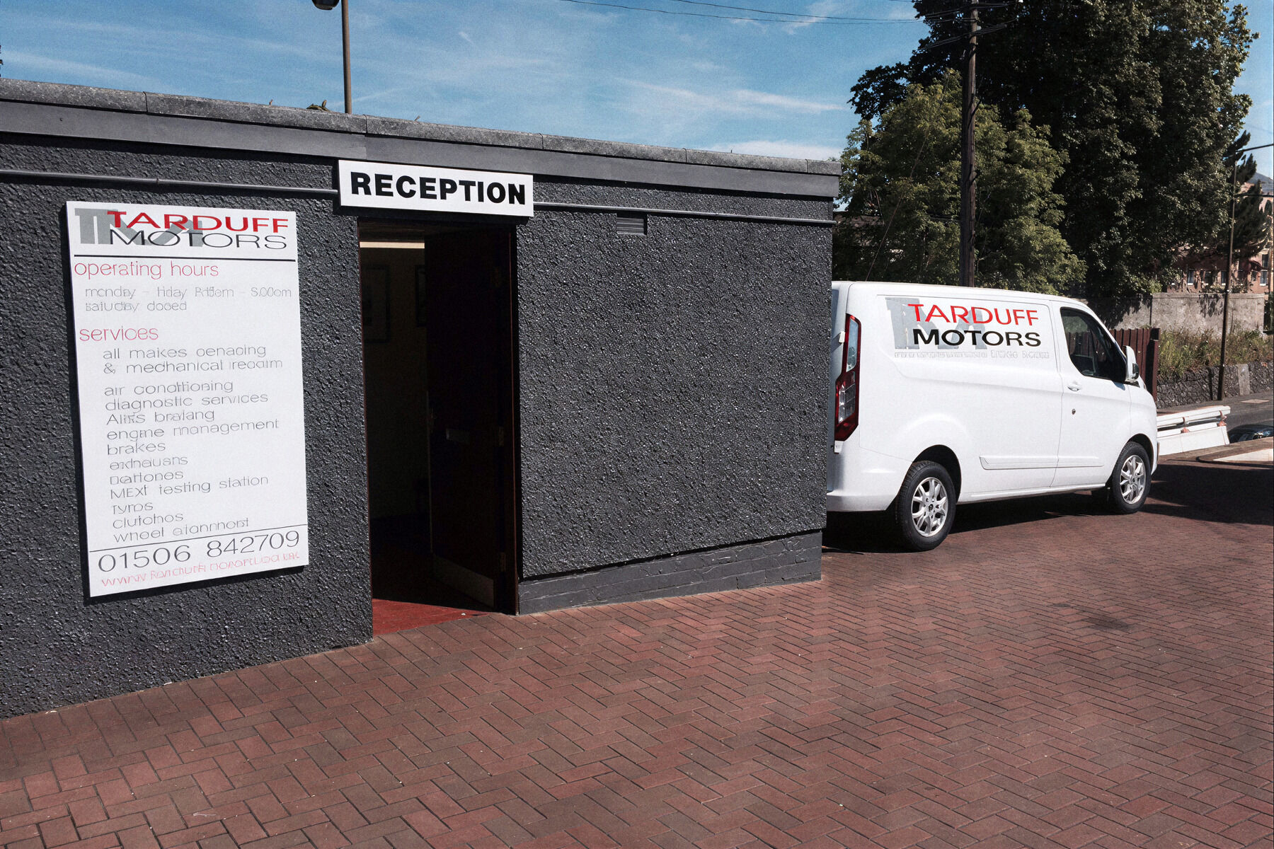 Reception building with the Tarduff Motors van